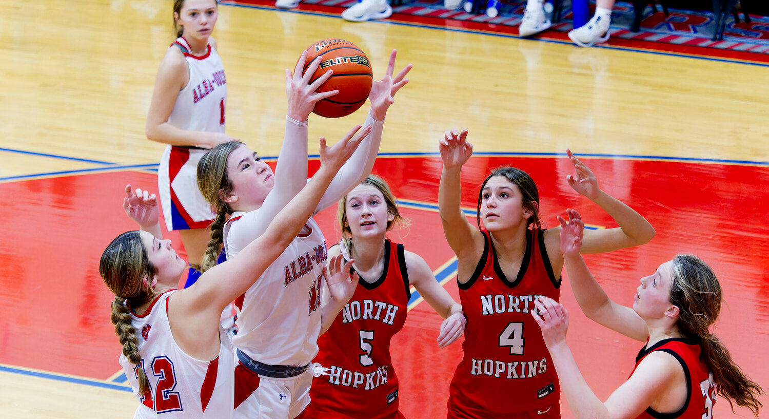 Lainey Teel battles for the rebound.